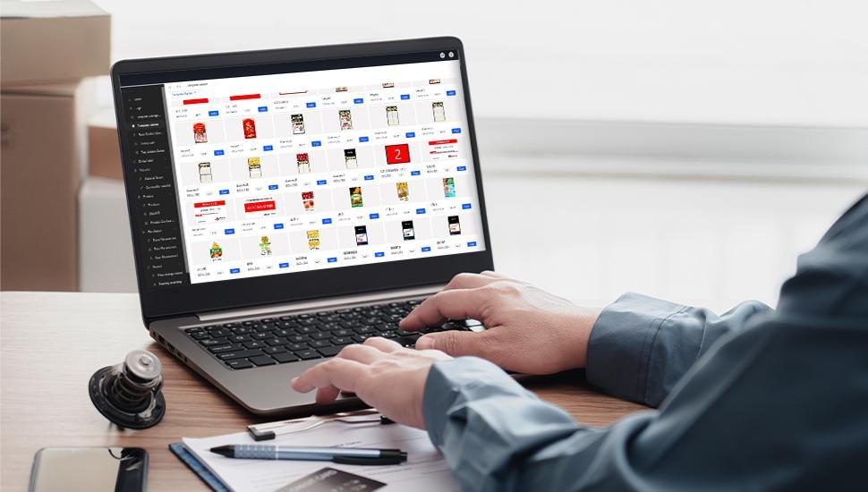 Store manager reviewing products and shelf labels in the management dashboard on a laptop